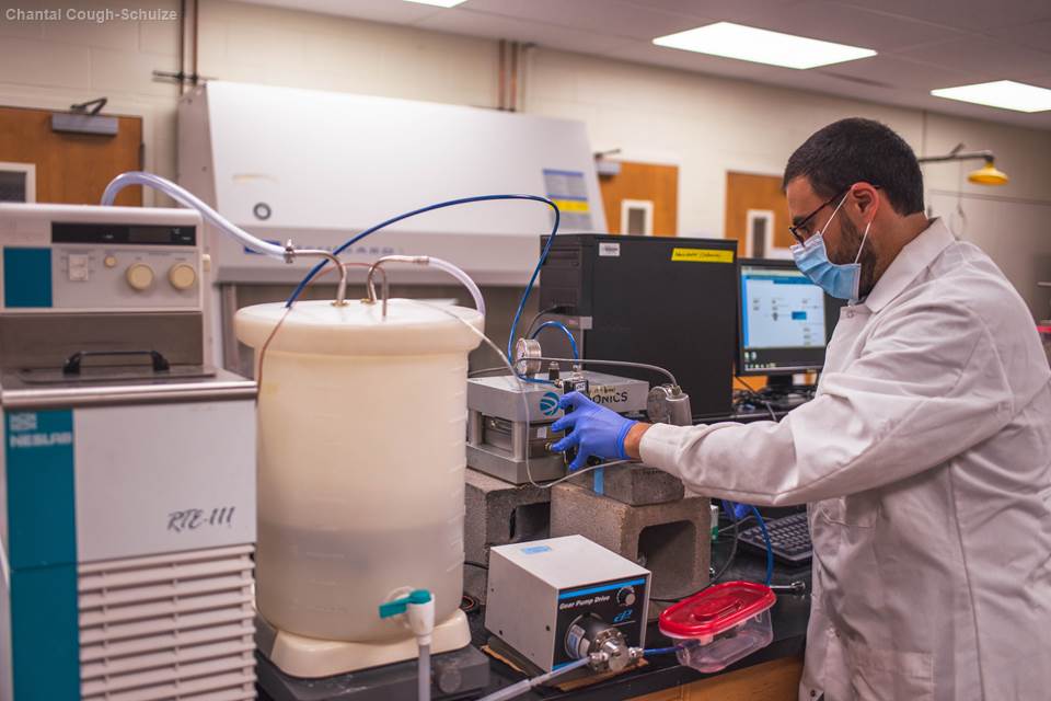 Bilal Abada, a Ph.D. student in Shankar Chellam’s lab at Texas A&M University, sets up the water-energy nanogrid in the lab.